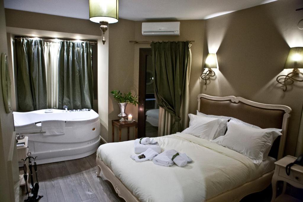 Melies Boutique Hotel Káto Loutrákion Rum bild